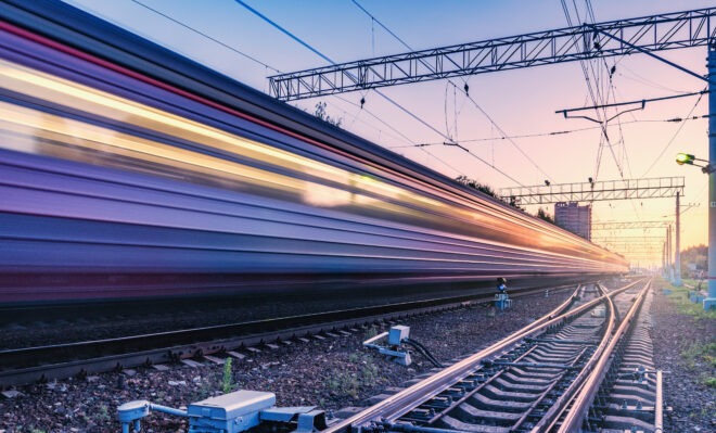 passenger-train-moves-fast-at-sunset-time